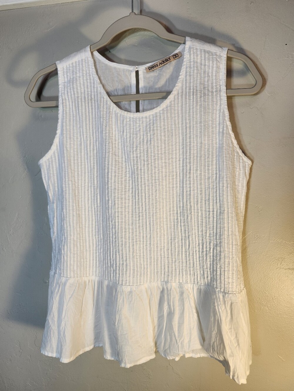 Dress Addict White Textured Sleeveless Peplum Blouse